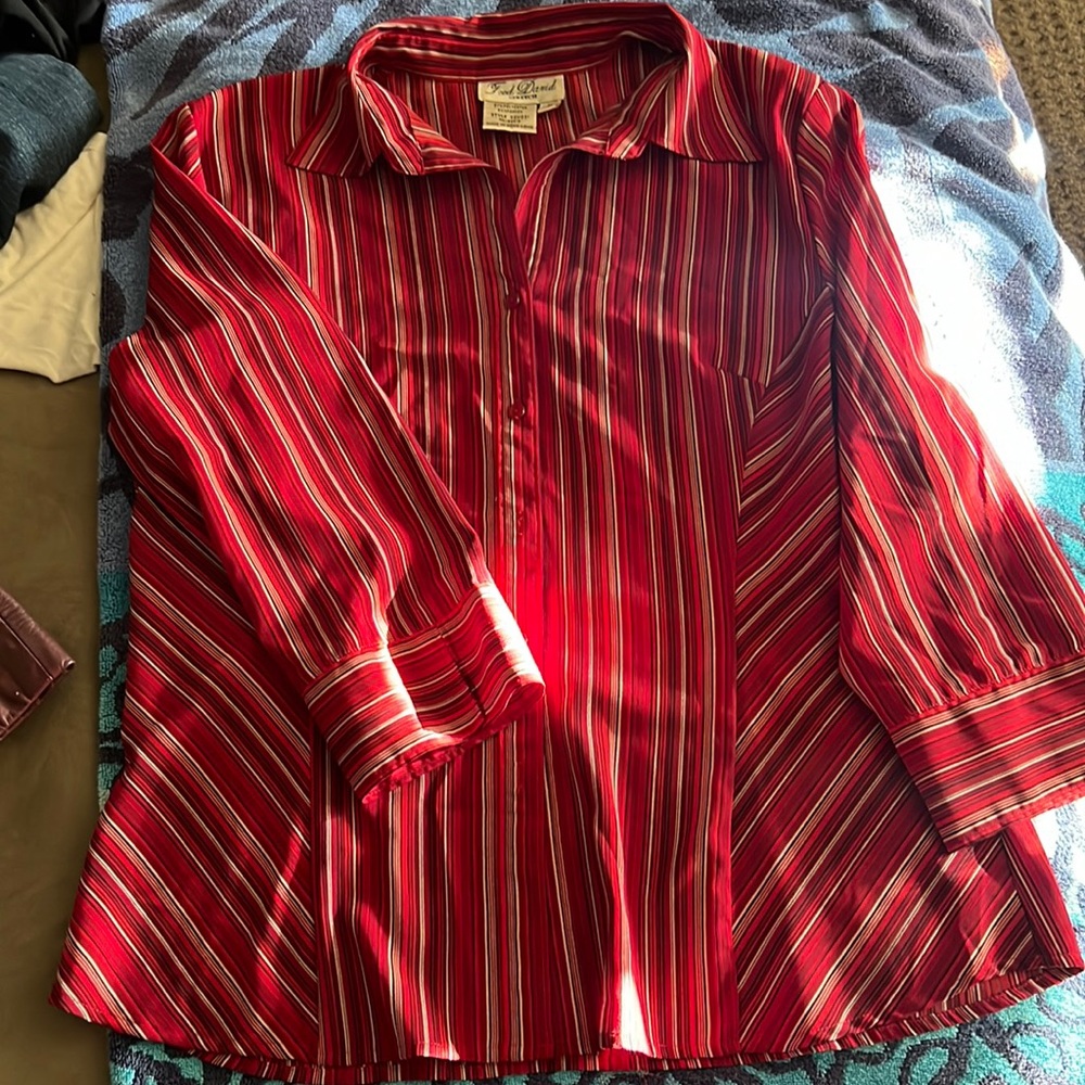 Dress blouse. Very shapely when on. Colors are red white and black.